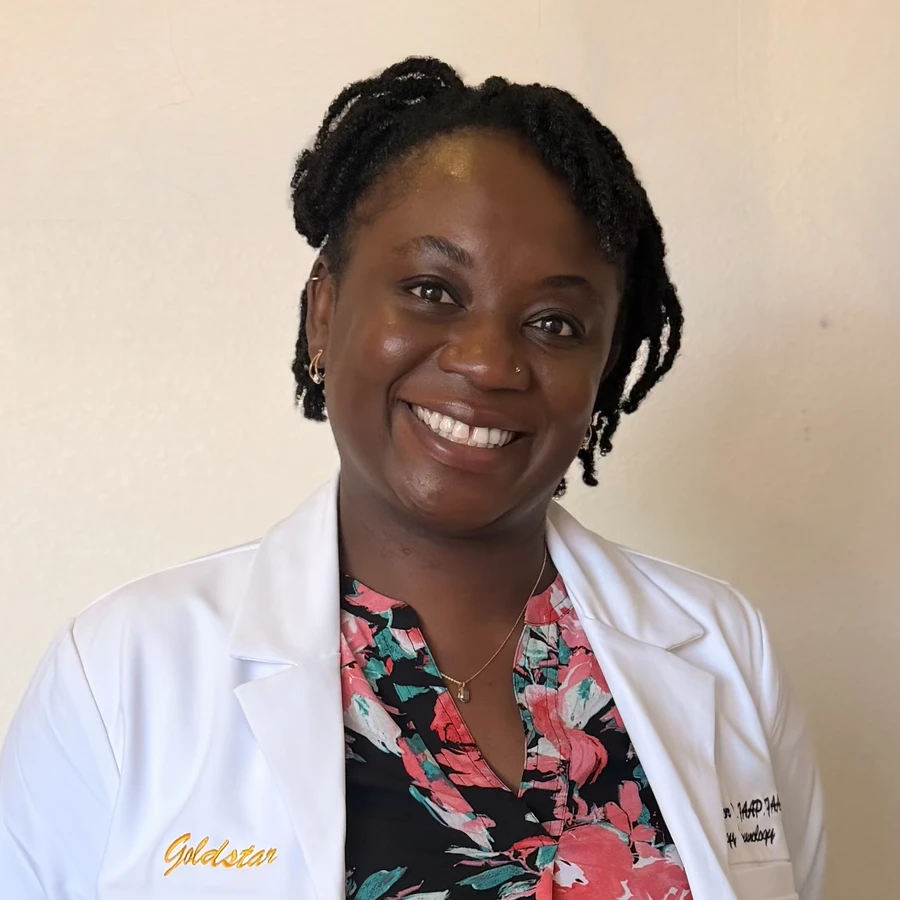 Dr. Chioma Enweasor, allergist at Goldstar Allergy in Fontana, smiling in a white coat