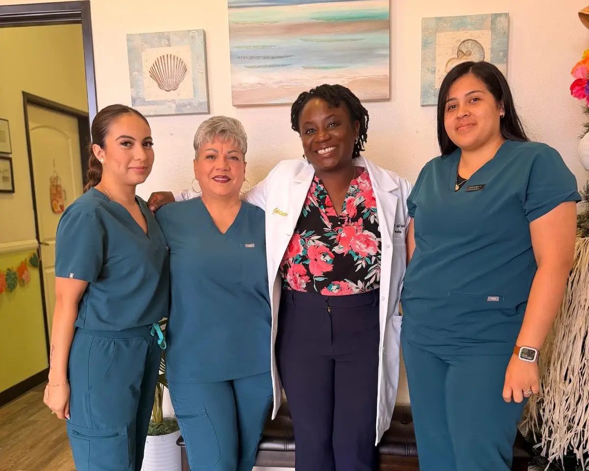 The Goldstar care team standing together in the Fontana office