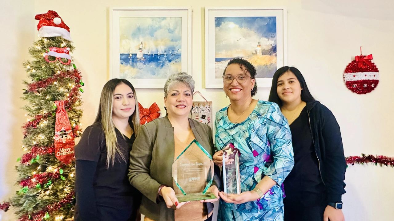 The Goldstar care team standing together in the Fontana office